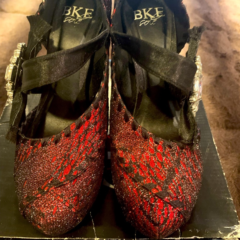Sparkle your way into any special occasion with these red glitter heels!